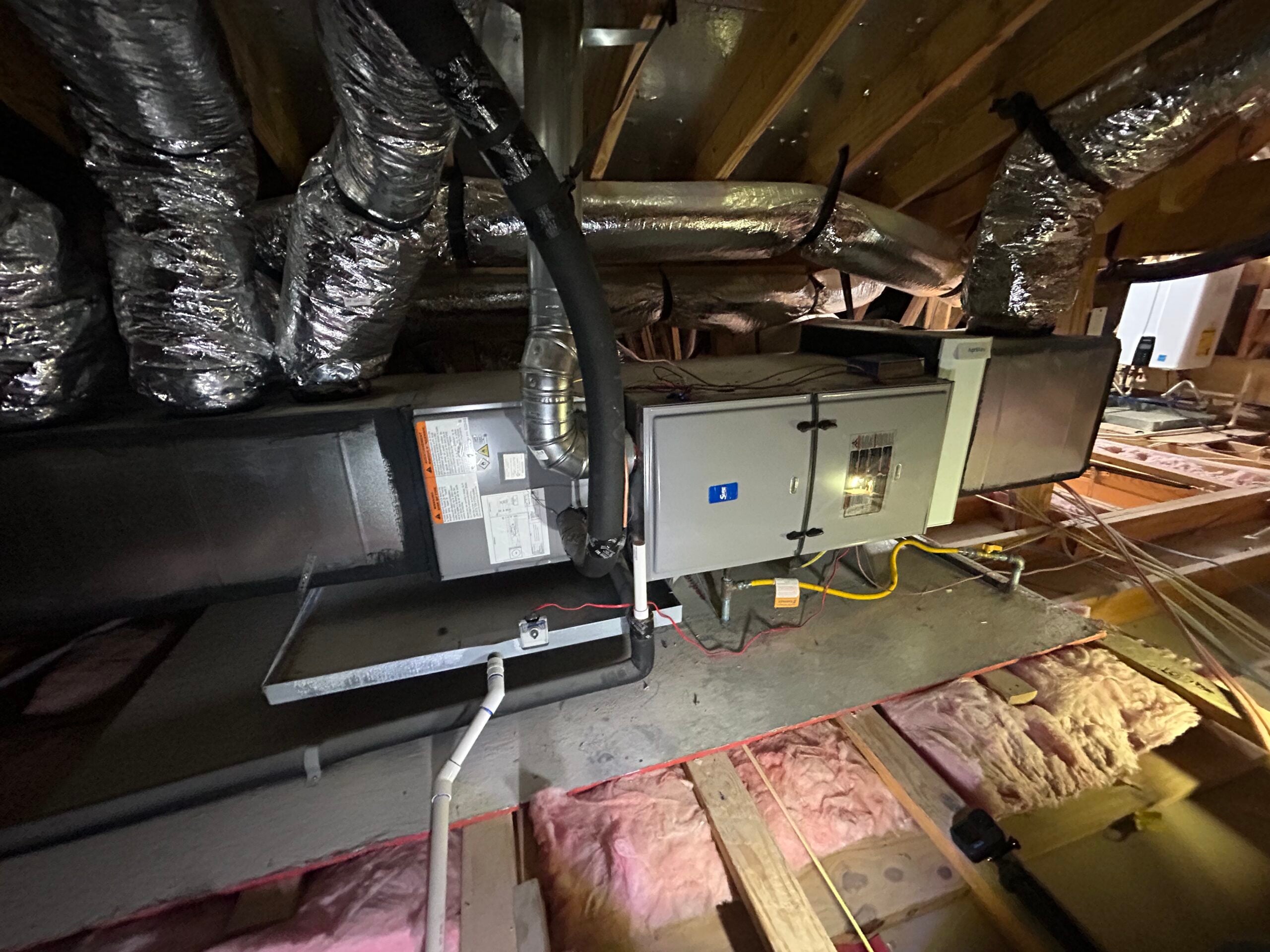 Hand-fabricated 26-gauge galvanized steel HVAC plenum, custom-built to match specific air handler dimensions for zero-leakage airflow.